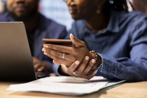 Homeowners reviewing their information with Consumer Advocacy Law Group before paying.